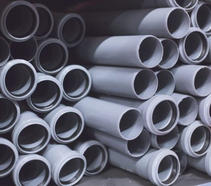 Packaged plastic water pipes at warehouse